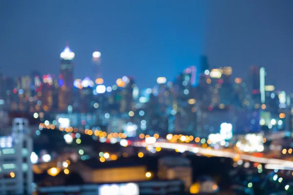 Abstract blurred bokeh lights, twilight city downtown background — Stock Photo, Image