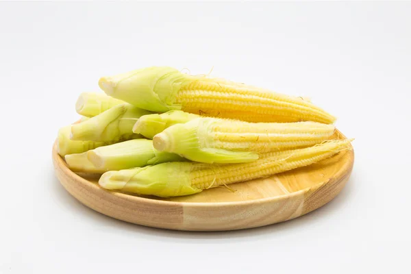 Baby corn on wooden plate — Stock Photo, Image