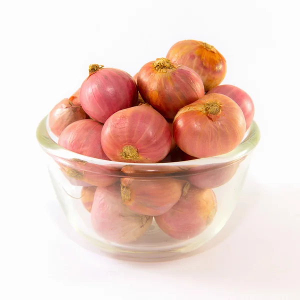 Aziatische rode uien in een glas buigen — Stockfoto