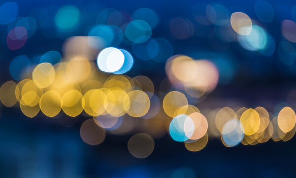 Abstract blur bokeh background of City light on bright colors style.