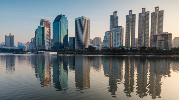 Bangkok Office building with water reflection during sunrise — Stock Photo, Image