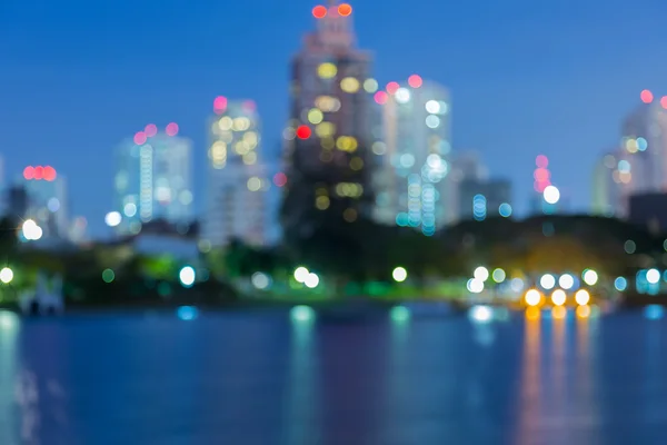 City light blur bokeh, defocused background, with water reflection — Stock Photo, Image