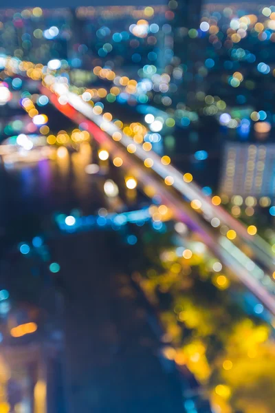 Blurred lights of bridge across river — Stock Photo, Image