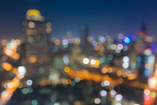 Rozmazané pozadí abstraktní s bokeh panoráma abangkok v noci — Stock fotografie