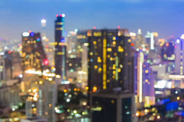Abstract blur bokeh city road at night with office building background