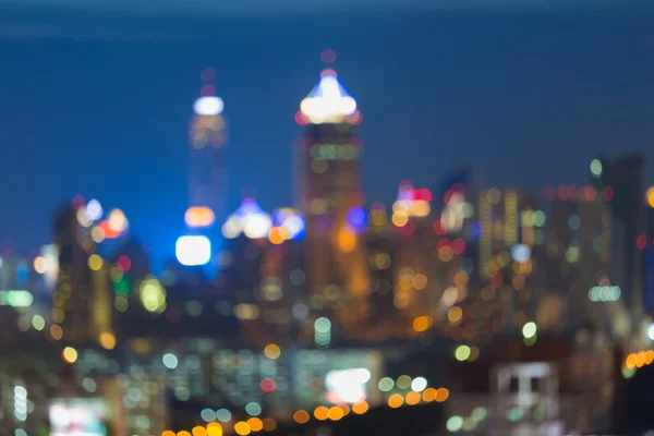 Abstrato borrão cidade luzes skyline durante horas azuis — Fotografia de Stock