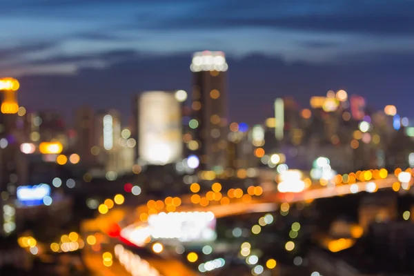 Rozostření pozadí bokeh panorama města během soumraku — Stock fotografie