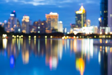 Water reflection of  city blur bokeh lights background