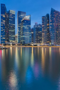Cityscape at Marina Bay Business District  twilight with water reflection Singapore