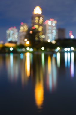 Abstract blur office building lights with water reflection