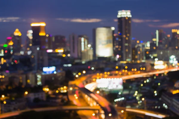 Astratto luci bokeh sfocatura di intersezione autostradale della città durante l'ora occupato — Foto Stock