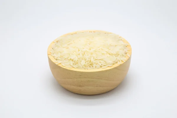 Wooden bowl with uncooked white rice — Stock Photo, Image
