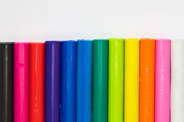 Rainbow colours plasticine clay on white background — Stock Photo, Image