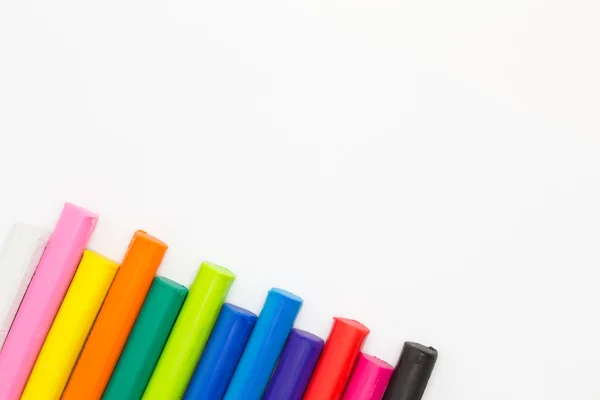 Multiple colors clay sticks on white background — Stock Photo, Image