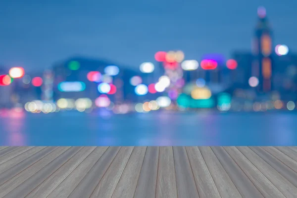 Opening wooden floor with Hong Kong blurred bokeh city lights — Stock Photo, Image