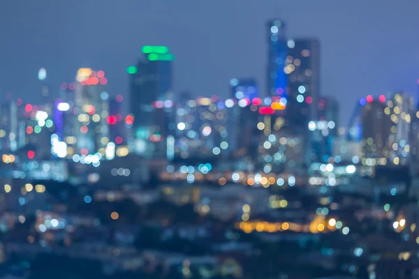 Sfondo chiaro città bokeh offuscata di notte — Foto Stock