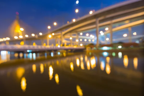 Abstract blurred bokeh, city highway with suspension bridge — Stock Photo, Image