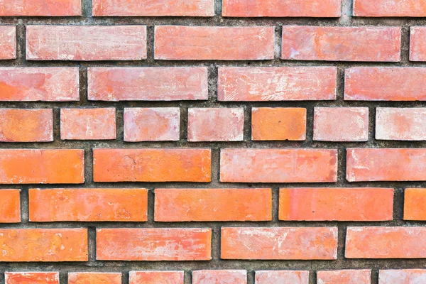 Pomarańczowy wzór cegły ściany bloku — Zdjęcie stockowe