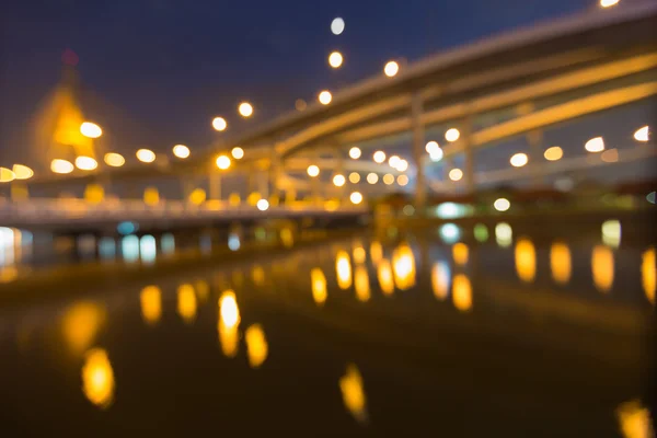 Suspension bridge with highway intersection, abstract blurred bokeh light — Stock Photo, Image