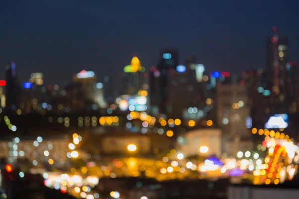 Ciudad desenfocada luces del centro por la noche — Foto de Stock