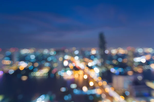 Luz de ciudad cercana borrosa, vista aérea, fondo bokeh abstracto — Foto de Stock