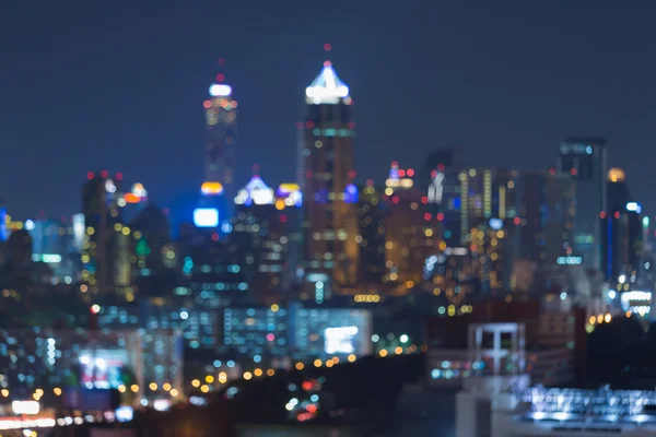 Nacht bokeh office gebouw stadslichten, abstracte achtergrond wazig — Stockfoto