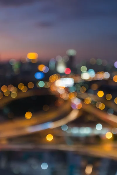 Verschwommene Bokeh Lichter Stadt nachts ausgetauscht — Stockfoto