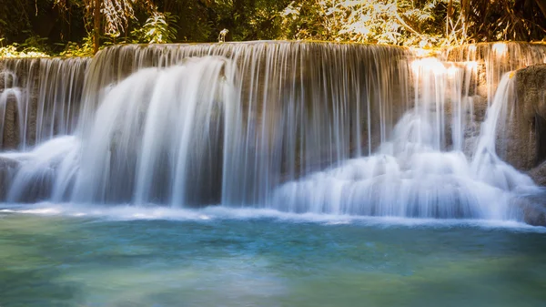 Beautiful tropical blue stream waterfalls in deep forest national park — Stock Photo, Image