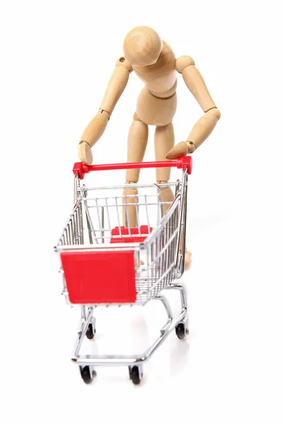 Sad man pushing a empty shopping cart — Stock Photo, Image