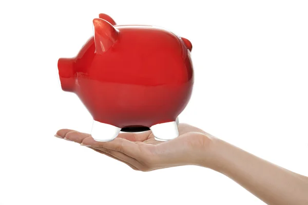 Red Piggy Bank in Hand — Stock Photo, Image