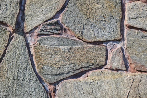 Taş duvar dokusu. Arka plan ya da doku olarak taş duvar. Arkaplan veya doku için taş bir duvarın parçası.