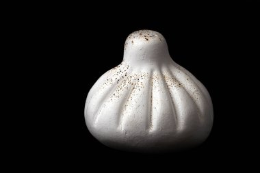  Pepper shaker, ceramic, khinkali-shaped, white on black background, horizontal