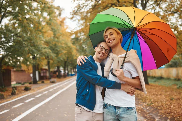 Loving Gay Couple Walking Outdoors Rainbow Umbrella Two Handsome Men —  Fotos de Stock