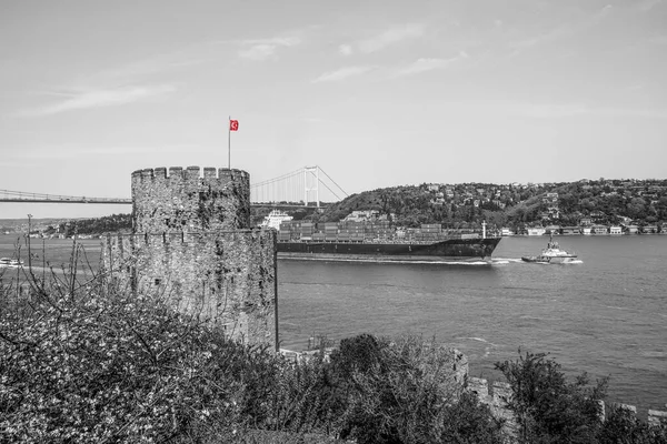Sea transportation, transportation of goods in containers on barges through the Bosphorus. Rumelihisari, Rumelian Castle, Roumeli Hissar Castle, is a medieval fortress, Istanbul, Turkey, on a series of hills on the European banks of the Bosphorus. Vi