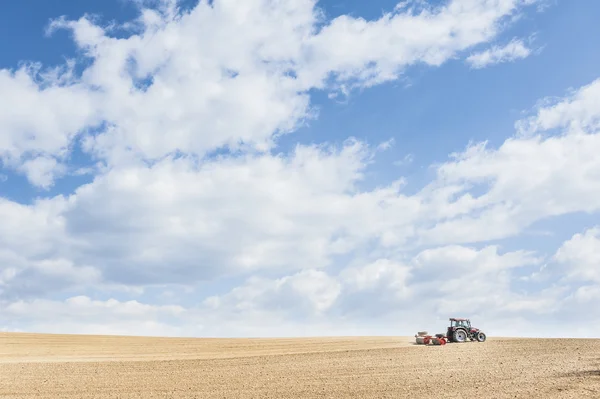 Tractor compresses the soil after planting with rollers. — Stock Photo, Image