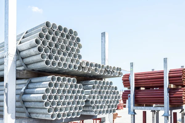 Stack of steel pipes for scaffolding in stock. — Stock Photo, Image