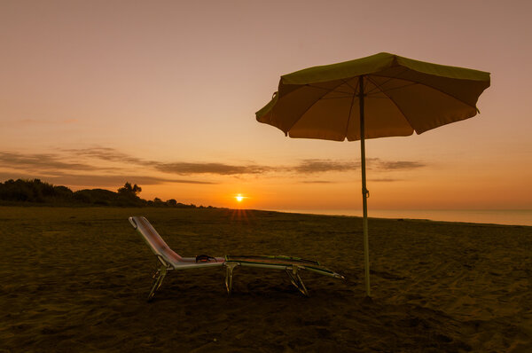 umbrella on the beach at sunset