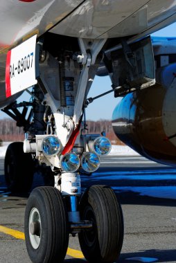 The forward chassis of the plane with headlights of head light
