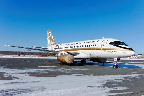 The passenger Sukhoi Superjet 100 plane in an original livery of "75 years of Sukhoi Design Bureau" — Stock Photo, Image