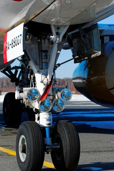 The forward chassis of the plane with headlights of head light