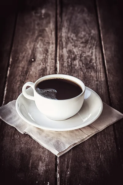 Black coffee on a wooden table — Stock Photo, Image