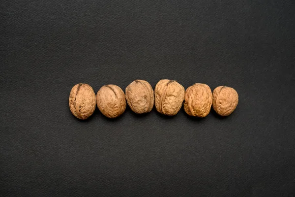 Ořechy Černém Pozadí Makro — Stock fotografie
