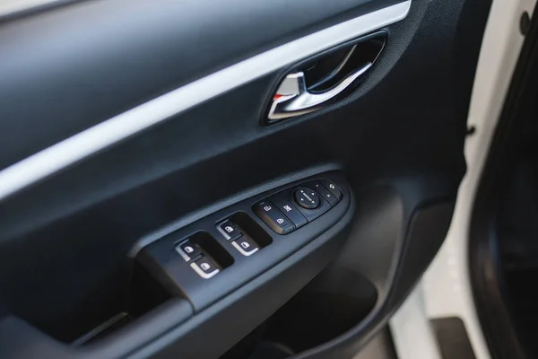 Car interior detail. Closeup of controls on the door — Stock Photo, Image