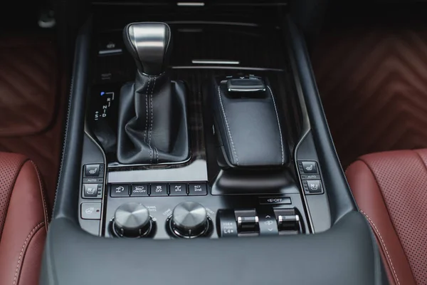 Detail of modern car interior, gear stick, automatic transmission in expensive car