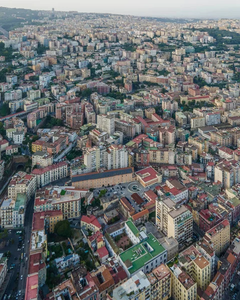 Aerial view of Naples downtown at sunset, view of the high density residential area on hillside, Naples, Italy.