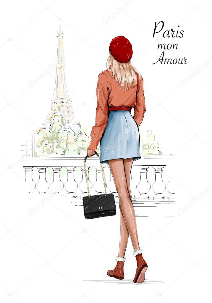 Beautiful woman in red beret. Fashion lady holding bag. Stylish girl walking near Eiffel Tower. 