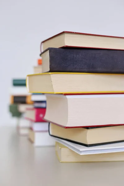 Stack of books on white background