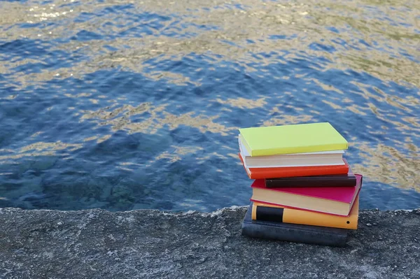 A bunch of books to read on the beach by the sea