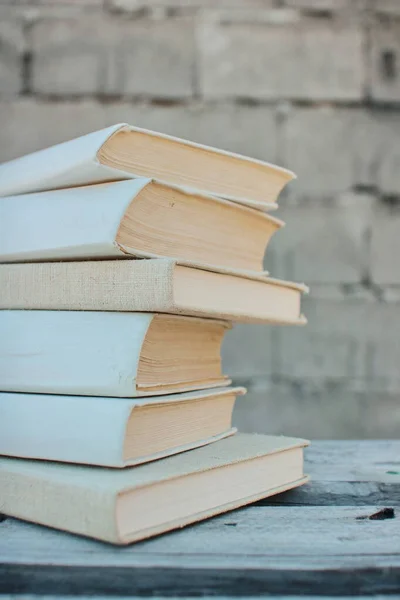 Books on a wooden box, books in an industrial setting