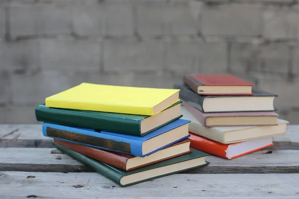 Books on a wooden box, books in an industrial setting